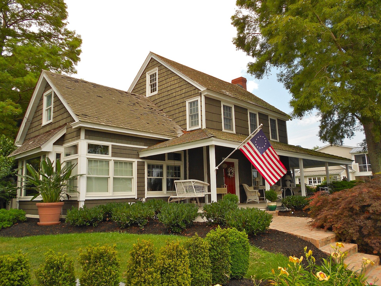 Shingled house with a covered porch in Lewes, Delaware